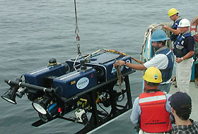 Image: A remotely operated vehicle is launched from the deck of the RV Connecticut.