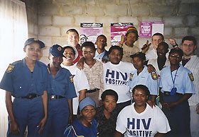 Image: Adam Mastrocola with clients and workers at an HIV/AIDS clinic.